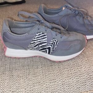 Little girls adorable New Balance sneakers